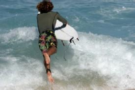 Board shorts diving in the ocean